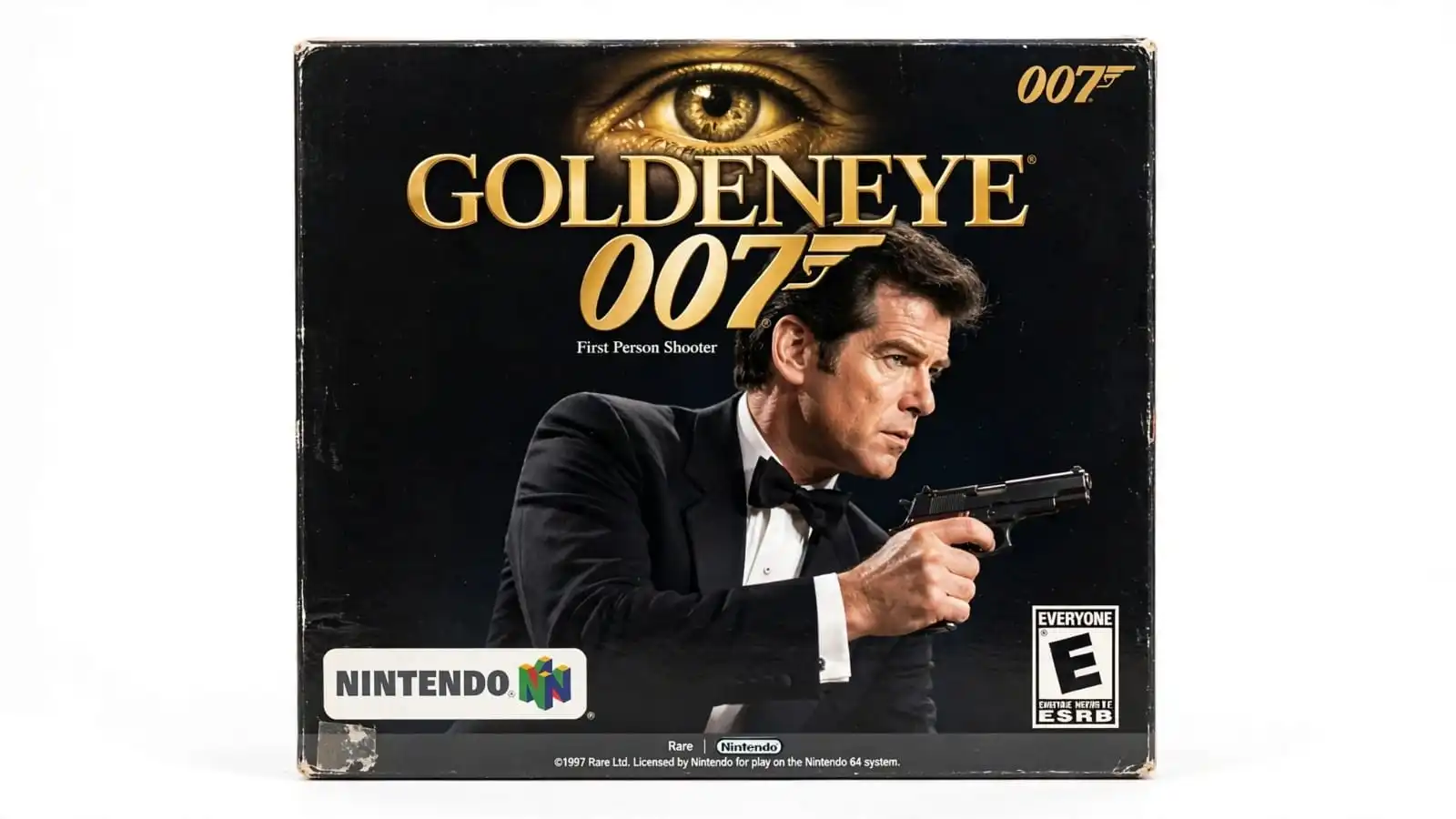 James Bond aims his weapon at enemies during a first-person shooting mission in GoldenEye 007. Among good N64 games for shooter fans, it features objective-based missions and four-player split-screen battles.